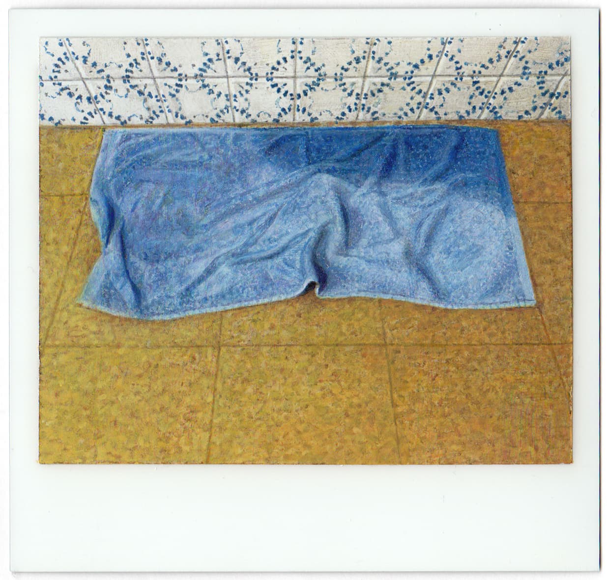 Blue wet towel on floor
